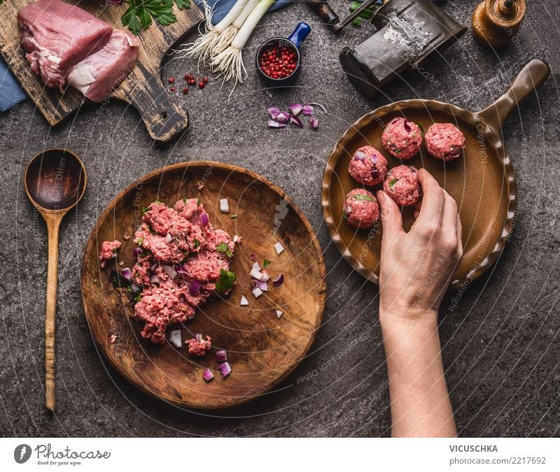 Hand puts meatballs in the pan Food Meat Nutrition Lunch Dinner Organic produce Plate Pan Spoon Style Design Living or residing Feminine Wooden spoon
