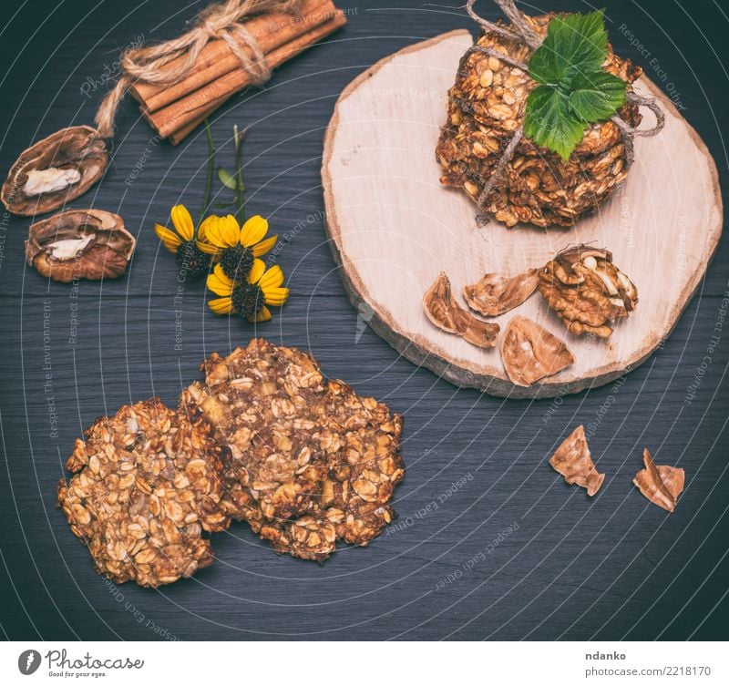 homemade oatmeal cookies Dessert Nutrition Breakfast Lunch Diet Hot Chocolate Table Flower Leaf Wood Eating Delicious Natural Brown Yellow Black Energy