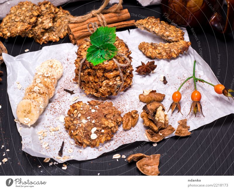 biscuits made from oatmeal and bananas Dessert Candy Nutrition Breakfast Lunch Vegetarian diet Diet Hot Chocolate Table Wood Eating Delicious Natural Brown