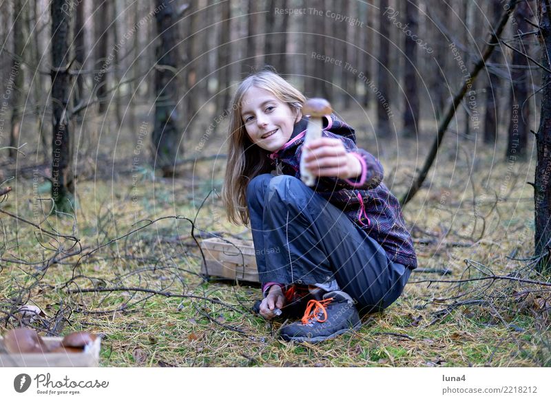 Girl with porcini Food 1 Human being 8 - 13 years Child Infancy Nature Autumn Forest Laughter Friendliness Happiness Joie de vivre (Vitality) Mushroom amass