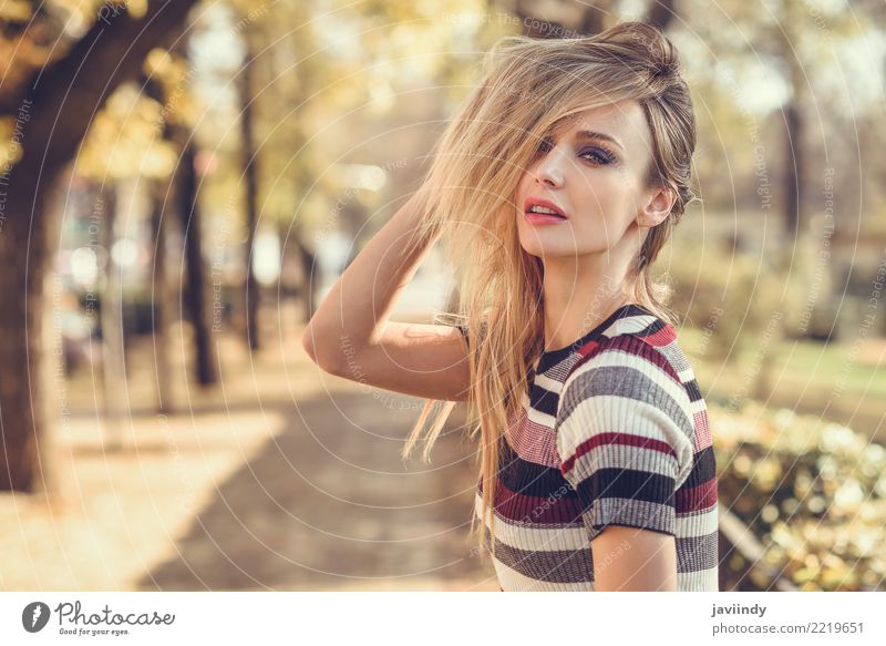 Young blonde woman moving her hair in the street Lifestyle Elegant Style Beautiful Hair and hairstyles Human being Young woman Youth (Young adults) Woman Adults