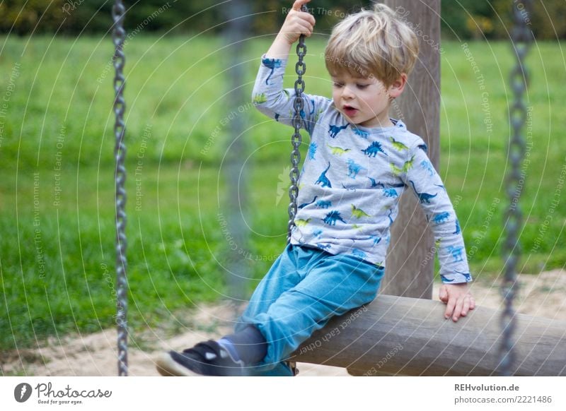 Child on the playground Leisure and hobbies Human being Boy (child) 1 3 - 8 years Infancy Nature Grass Meadow Playground Movement Playing Authentic Small