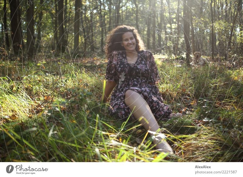 Portrait of tall beautiful woman with long dark curly hair in forest - blond Labrador waiting in background pretty Life Senses Young woman Youth (Young adults)