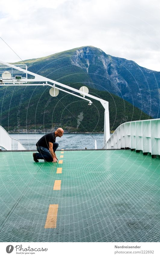Man kneels on a deck of a ship Lifestyle Vacation & Travel Human being Masculine Adults Landscape Water Summer Fjord Means of transport Traffic infrastructure