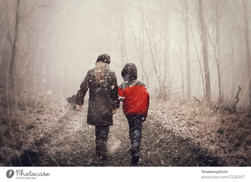 Winter fairy tale: two children on a snowy, foggy forest path - a Royalty  Free Stock Photo from Photocase