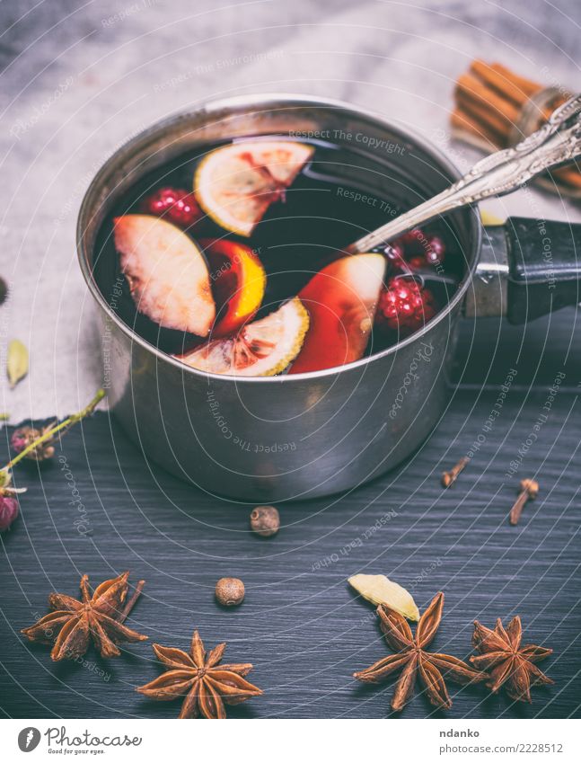 mulled wine in an aluminum ladle Apple Herbs and spices Beverage Alcoholic drinks Mulled wine Bowl Spoon Winter Decoration Table Feasts & Celebrations
