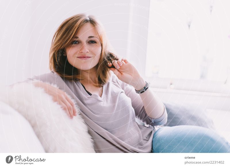 Portrait of smiling caucasian woman at home Joy Happy Relaxation Leisure and hobbies House (Residential Structure) Sofa Living room Woman Adults