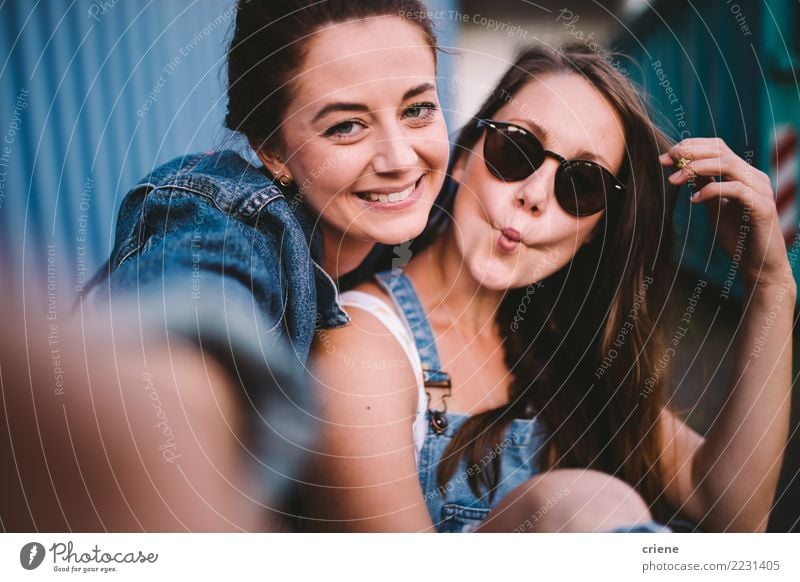Two happy girlfriends taking selfie together Lifestyle Joy Happy Leisure and hobbies Camera Technology Woman Adults Friendship Youth (Young adults) Kissing