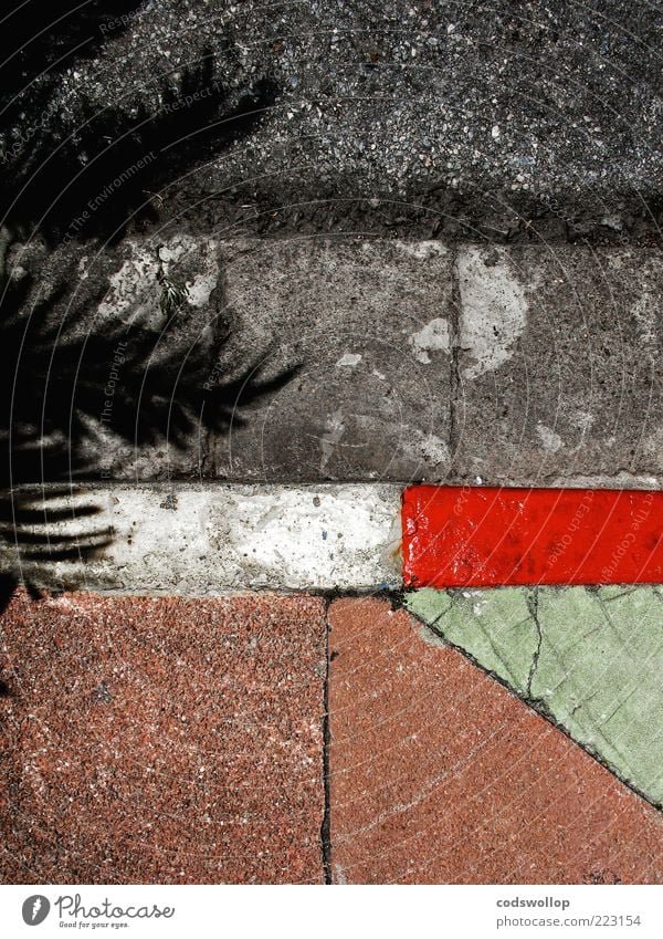 winter holidays on the roadside Street Sharp-edged Gray Green Red White Curbside Roadside Geometry Structures and shapes Sidewalk Pavement Colour photo