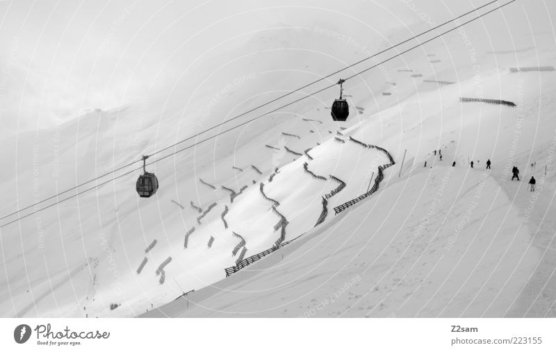 white happiness Vacation & Travel Snow Winter vacation Mountain Winter sports Landscape Clouds Bad weather Fog Alps Cable car Ski lift Dark Gigantic Gloomy Gray