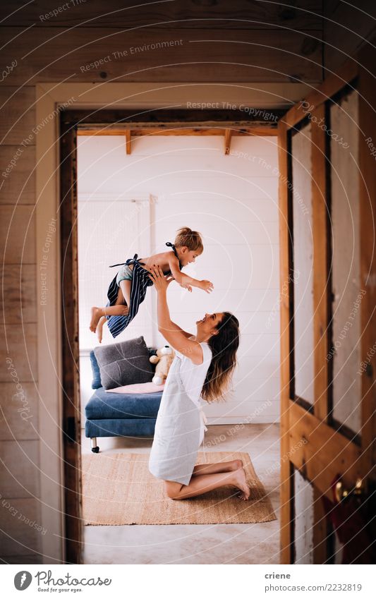 Young mom having fun with toddler son at home Lifestyle Joy Happy Playing Living or residing Flat (apartment) House (Residential Structure) Living room