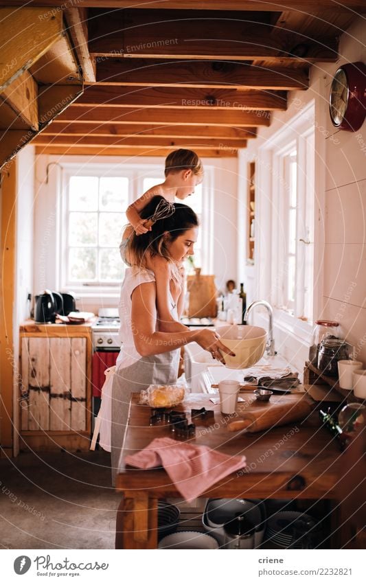 Mother and toddler son baking in the kitchen together Bowl Lifestyle Joy Happy Leisure and hobbies House (Residential Structure) Kitchen Parenting Child