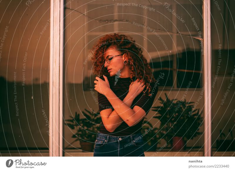 Young woman hugging herself Lifestyle Exotic Beautiful Harmonious Senses Calm Human being Feminine Youth (Young adults) 1 18 - 30 years Adults Plant Window