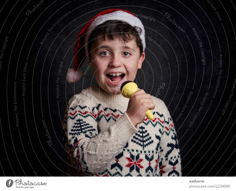 child singing Christmas carol at Christmas Lifestyle Joy Party Event Music Feasts & Celebrations Christmas & Advent New Year's Eve Human being Masculine Child