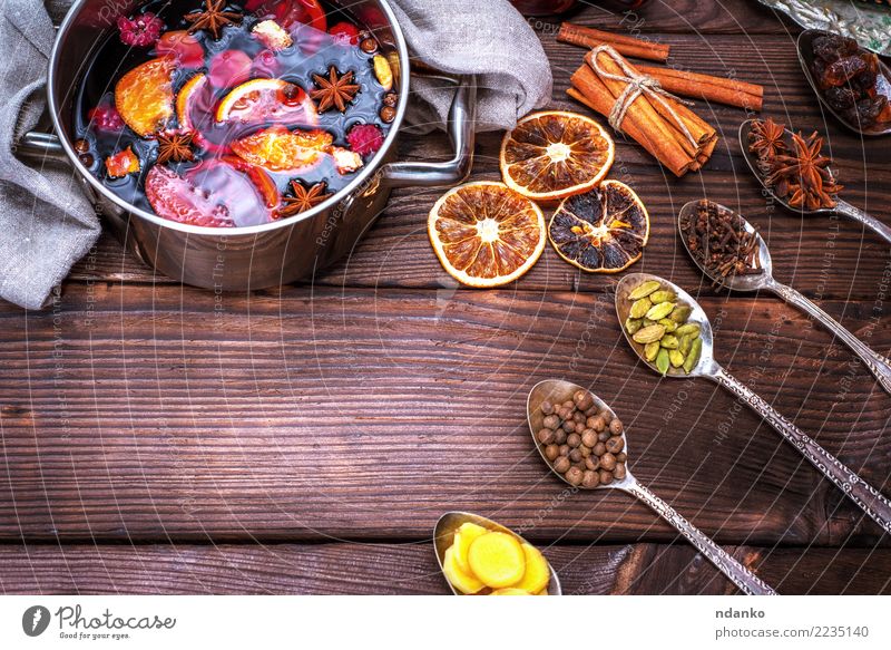 mulled wine in a saucepan and iron spoons Apple Herbs and spices Beverage Alcoholic drinks Mulled wine Pot Spoon Winter Table Feasts & Celebrations