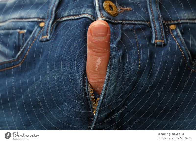 Finger sticking out of blue jeans fly open Healthy Human being Man Adults Body Fingers 1 Aggression Eroticism Brash Naked Blue Self-confident Surprise Arrogant
