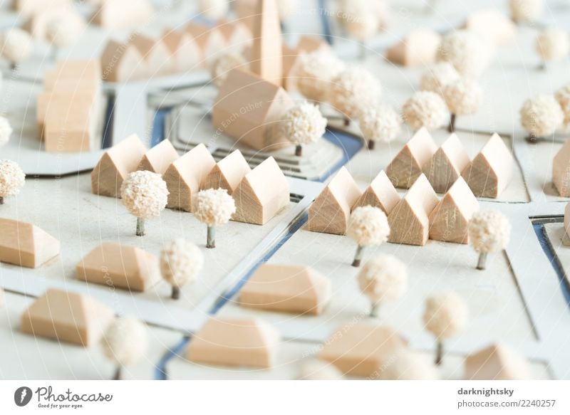 A newly planned village with residential houses, terraced houses and bungalows, new urbanism. The model is constructed of wood, cardboard and trees of foam rubber. It is a holiday village in northern Germany
