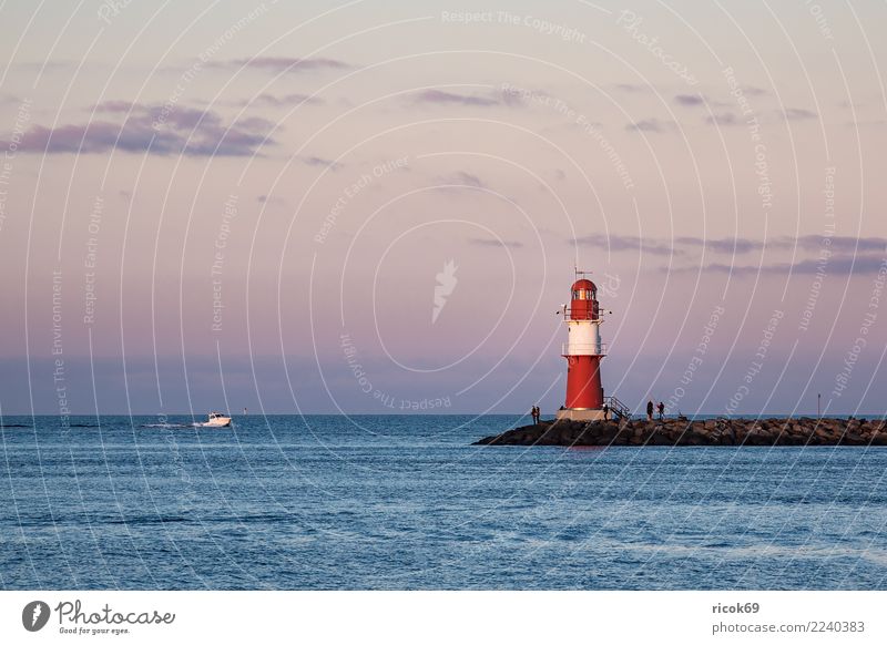Mole at the Baltic Sea coast in Warnemünde Relaxation Vacation & Travel Tourism Ocean Nature Landscape Water Clouds Coast Lighthouse Architecture