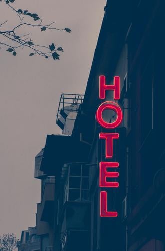 Small cheap hotel Vacation & Travel Tourism Building Facade Colour Hotel sign Text Accommodation Word Conceptual design entrance exterior holiday brick light