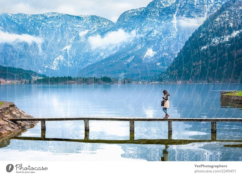 Girl walking on a deck over an alpine lake Vacation & Travel Tourism Freedom Mountain Human being Feminine Young woman Youth (Young adults) Woman Adults 1