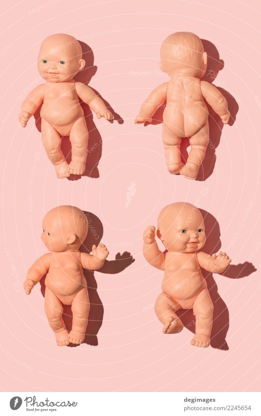 Baby doll on pink Design Skin Playing Child Infancy Toys Doll Plastic Old Sit Naked Cute Blue Pink isolated background dolly dolls head Object photography girl