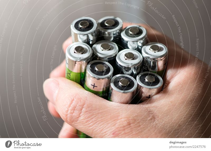 Hand hold many batteries Industry Human being Woman Adults Environment Energy Considerate Battery power Recycling alkaline Conceptual design Ecological Heap
