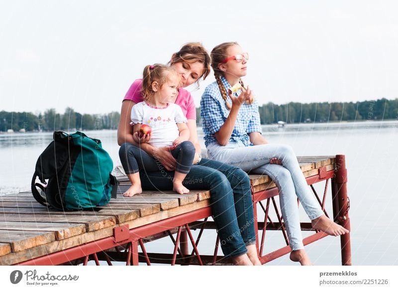 Family spending vacation time together sitting over the lake Joy Happy Relaxation Leisure and hobbies Vacation & Travel Summer Summer vacation Child Toddler