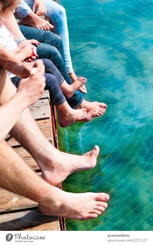 Close shot of legs family spending time together sitting on jetty over the lake in the summertime Joy Happy Relaxation Leisure and hobbies Vacation & Travel