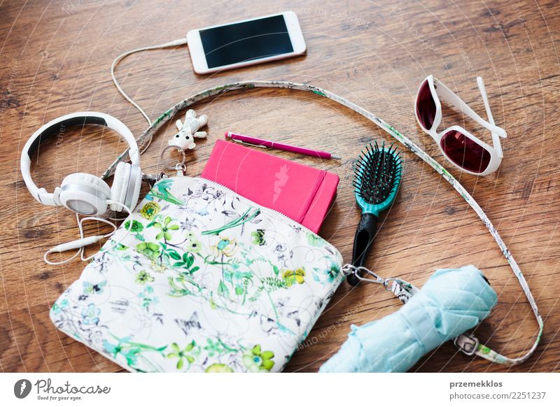 Things pulled out of handbag Lifestyle Style Contentment Telephone Cellphone PDA Accessory Pen Above brush glasses Handbag Headphones key mobile notebook
