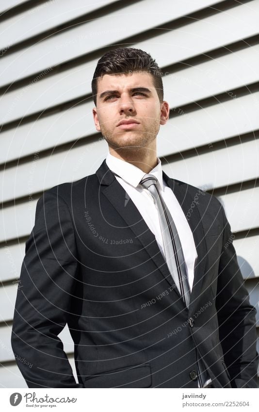 Young businessman in urban background Beautiful Hair and hairstyles Success Profession Office Business Human being Masculine Young man Youth (Young adults) Man