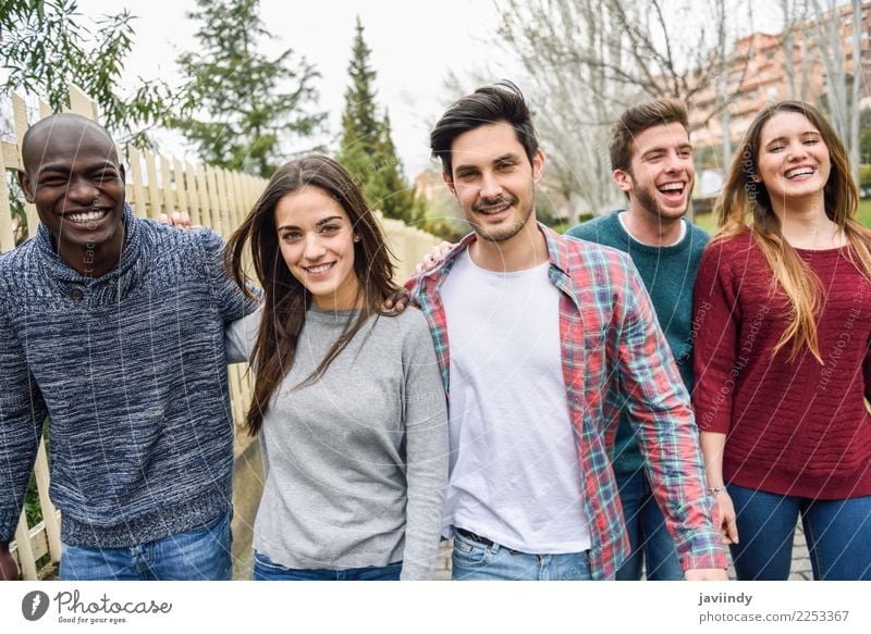 Group of multi-ethnic young people laughing together outdoors in urban background. Lifestyle Joy Happy Human being Young woman Youth (Young adults) Young man