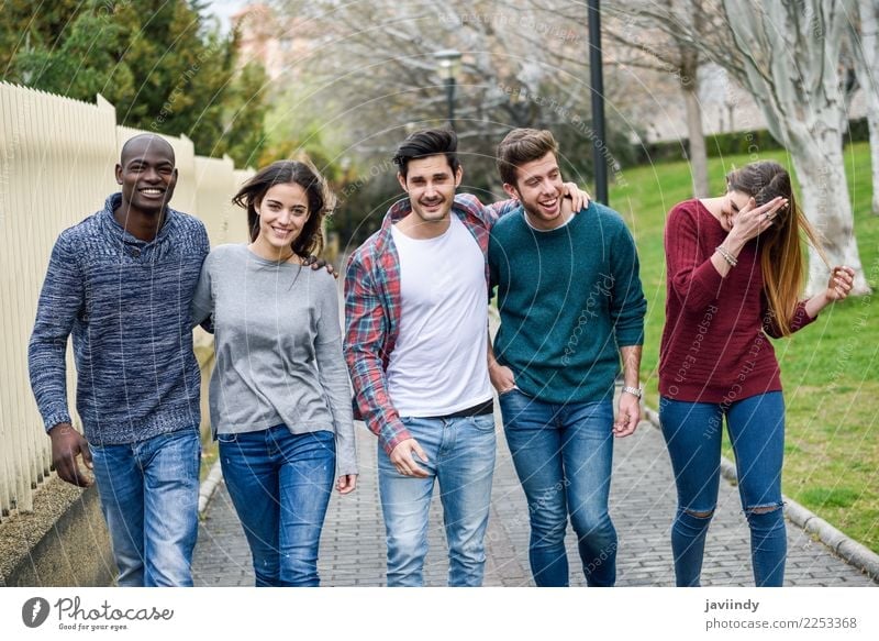 Group of multi-ethnic young people having fun together outdoors in urban background. Lifestyle Joy Happy Human being Young woman Youth (Young adults) Young man