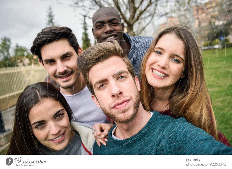 Multiracial group of friends taking selfie in a urban park Lifestyle Joy Happy Beautiful Leisure and hobbies Vacation & Travel Telephone PDA Camera Technology