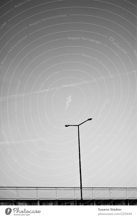 T Street Lanes & trails Bridge Lantern Bridge railing Handrail Gloomy Vapor trail Cloudless sky Black & white photo Exterior shot Deserted Copy Space top Dawn