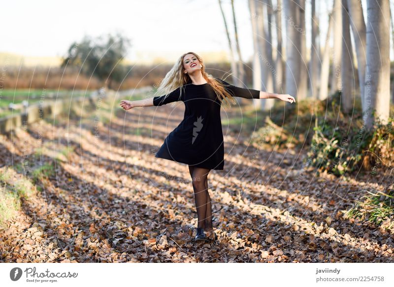 Young blonde woman dancing in poplar forest. Joy Happy Beautiful Hair and hairstyles Human being Woman Adults 1 18 - 30 years Youth (Young adults) Nature Autumn