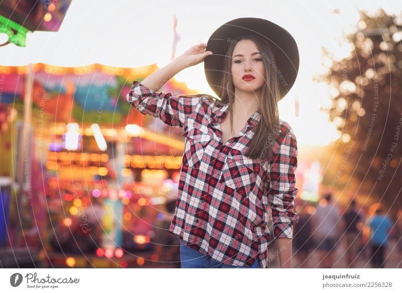 beauty girl with a hat in a fair with many lights Lifestyle Joy Happy Beautiful Entertainment Woman Adults Park Hat Happiness White Carousel Amusement Park