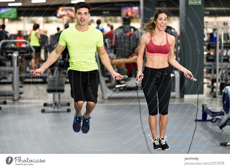 Young man and woman workout with jumping rope Lifestyle Joy Happy Beautiful Sports Rope Human being Masculine Feminine Young woman Youth (Young adults) Woman