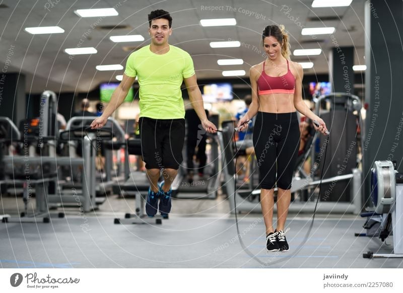 Young man and woman workout with jumping rope Lifestyle Joy Happy Beautiful Sports Rope Human being Masculine Feminine Young woman Youth (Young adults) Woman