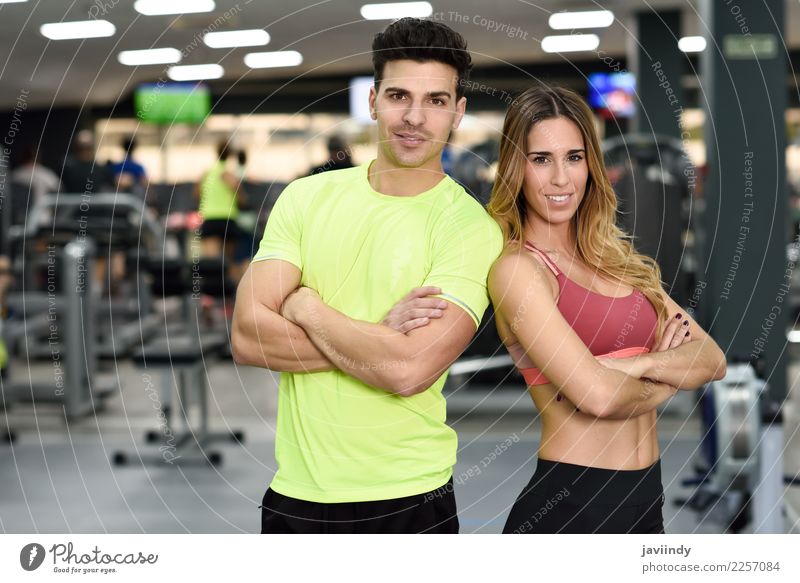 Man and woman personal trainers in the gym. Lifestyle Happy Beautiful Body Sports Human being Masculine Feminine Young woman Youth (Young adults) Young man