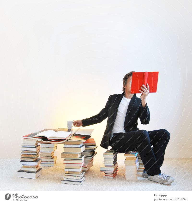 Man in book pile reading a book Lifestyle Relaxation Calm Leisure and hobbies Reading Education Human being Masculine Adults 1 30 - 45 years Study Sit Red Book