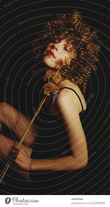 Artistic portrait of a young woman holding dried flowers Elegant Style Beautiful Body Hair and hairstyles Skin Human being Feminine Young woman