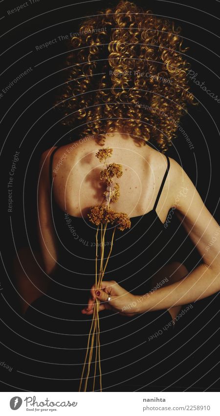 Back view of a young woman holding dried flowers Elegant Style Body Hair and hairstyles Skin Wellness Human being Feminine Young woman Youth (Young adults) 1