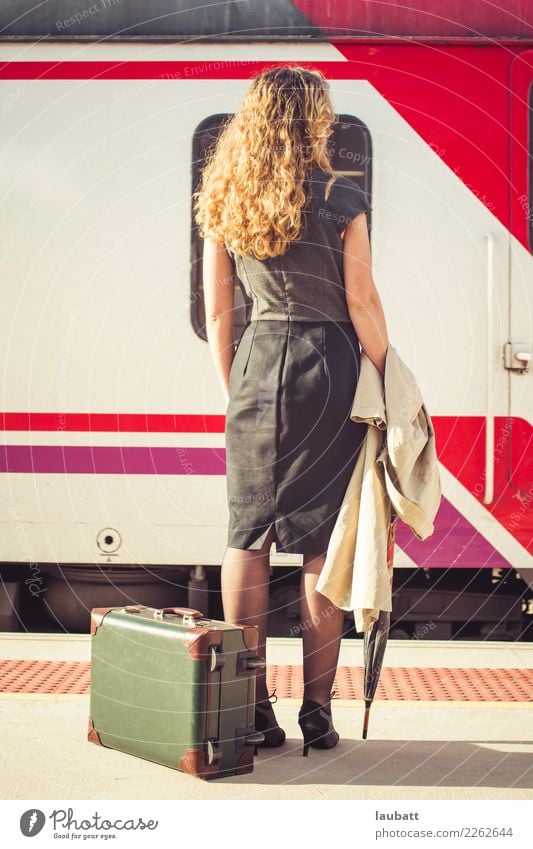 Young woman waiting for a train - Vertical view Lifestyle Vacation & Travel Tourism Trip Adventure Far-off places City trip Woman Adults Transport