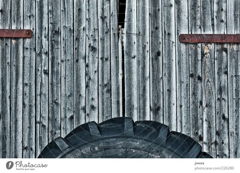 Mobile barn Hut Door Wood Old Gray Black Barn door Tire Colour photo Subdued colour Pattern Deserted Day Wide angle