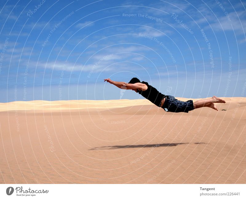Hard landing Vacation & Travel Freedom Masculine Young man Youth (Young adults) 1 Human being Sand Desert Flying Jump Athletic Joie de vivre (Vitality)