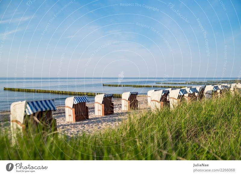Beach chairs at the Baltic Sea beach Relaxation Calm Vacation & Travel Far-off places Ocean Sand Water Sky Coast Lake Friendliness Bright Blue Loneliness