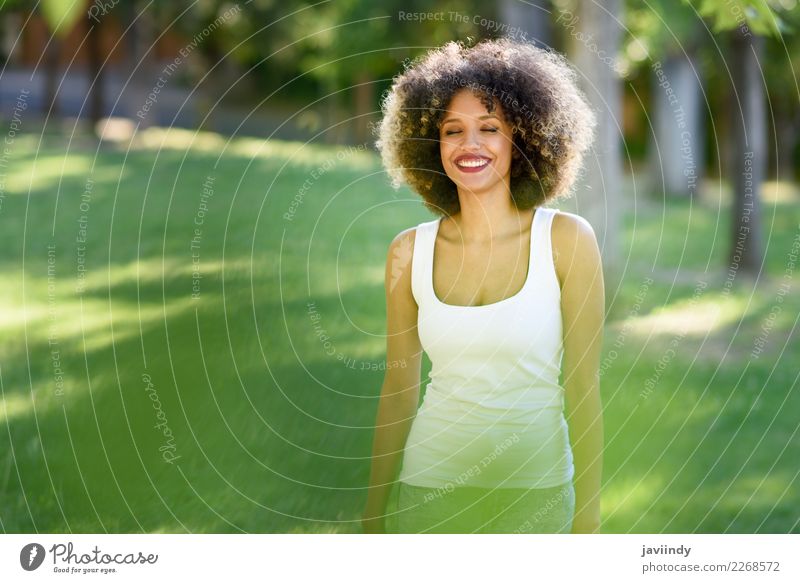 Black woman with afro hairstyle smiling in urban park Lifestyle Hair and hairstyles Summer Human being Young woman Youth (Young adults) Woman Adults 1