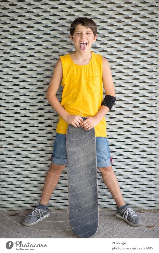 Close-up of a teenage boy carrying skateboard and smiling Lifestyle Style Joy Happy Sports Schoolchild Human being Boy (child) Man Adults Infancy Street Fashion