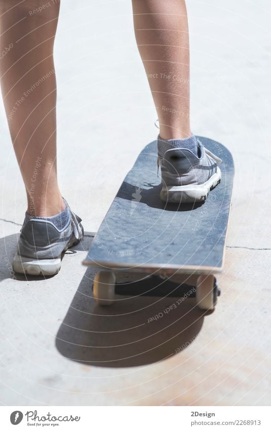 Close-up skateboarder balancing on skateboard ready for action Woman Adults Youth (Young adults) Feet Youth culture Concrete Movement Speed Blue Action