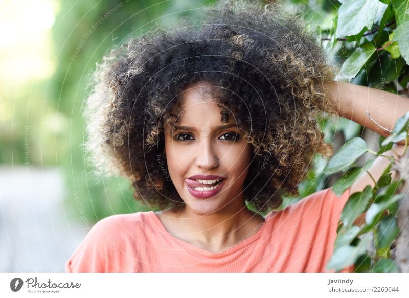 Black woman with tongue out in an urban park Lifestyle Style Joy Happy Beautiful Hair and hairstyles Face Human being Feminine Young woman Youth (Young adults)